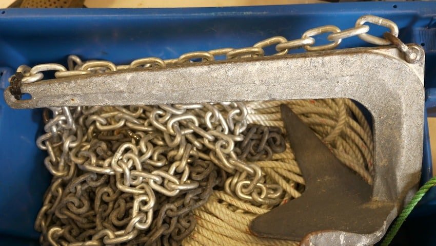 A claw anchor rigged for halibut anchoring with a breakaway chain and a heavy-duty zap strap. This setup shows the anchor chain secured to the crown for safe retrieval in BC tidal waters.