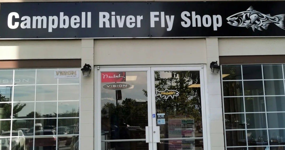 Signage for Campbell River Fly Shop displayed above the entrance, featuring a fish graphic and large text.