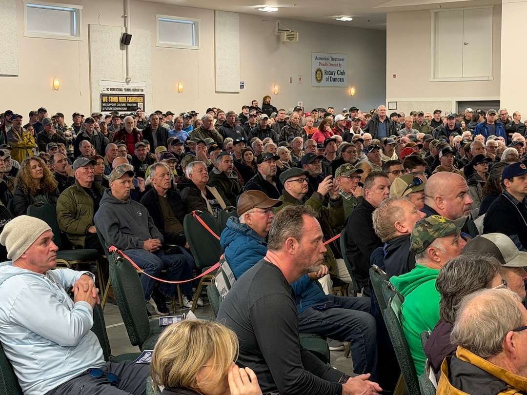 A capacity crowd of over 1,400 people seated in a large hall at the Cowichan Exhibition Park in Duncan, BC, for the BC Recreational Fishing Association town hall.