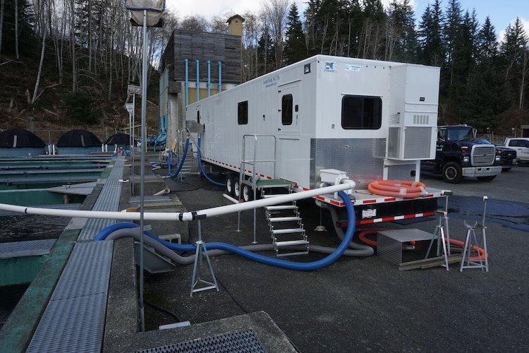DFO mobile tagging trailer used for mass marking hatchery salmon to support BC recreational fisheries.